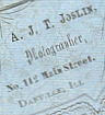 A. J. T. Joslin, Photographer, No. 112 Main Street, Danville, Ill.
