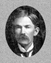 A very handsome portrait in an oval frame, a young man with a Mark Twain-tyle moustache