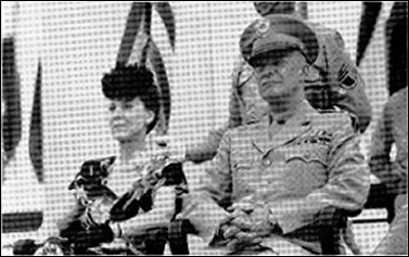 [photos of Eisenhower in uniform during his visit to Kansas, one including his wife, Mamie.]